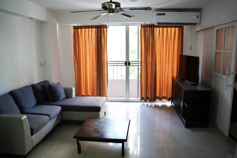 Suite living room with sofa and balcony doors