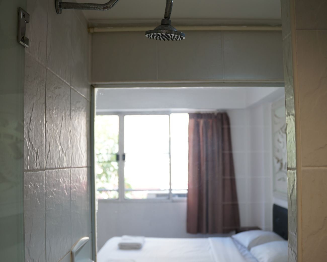 Suite shower looking through to the bedroom